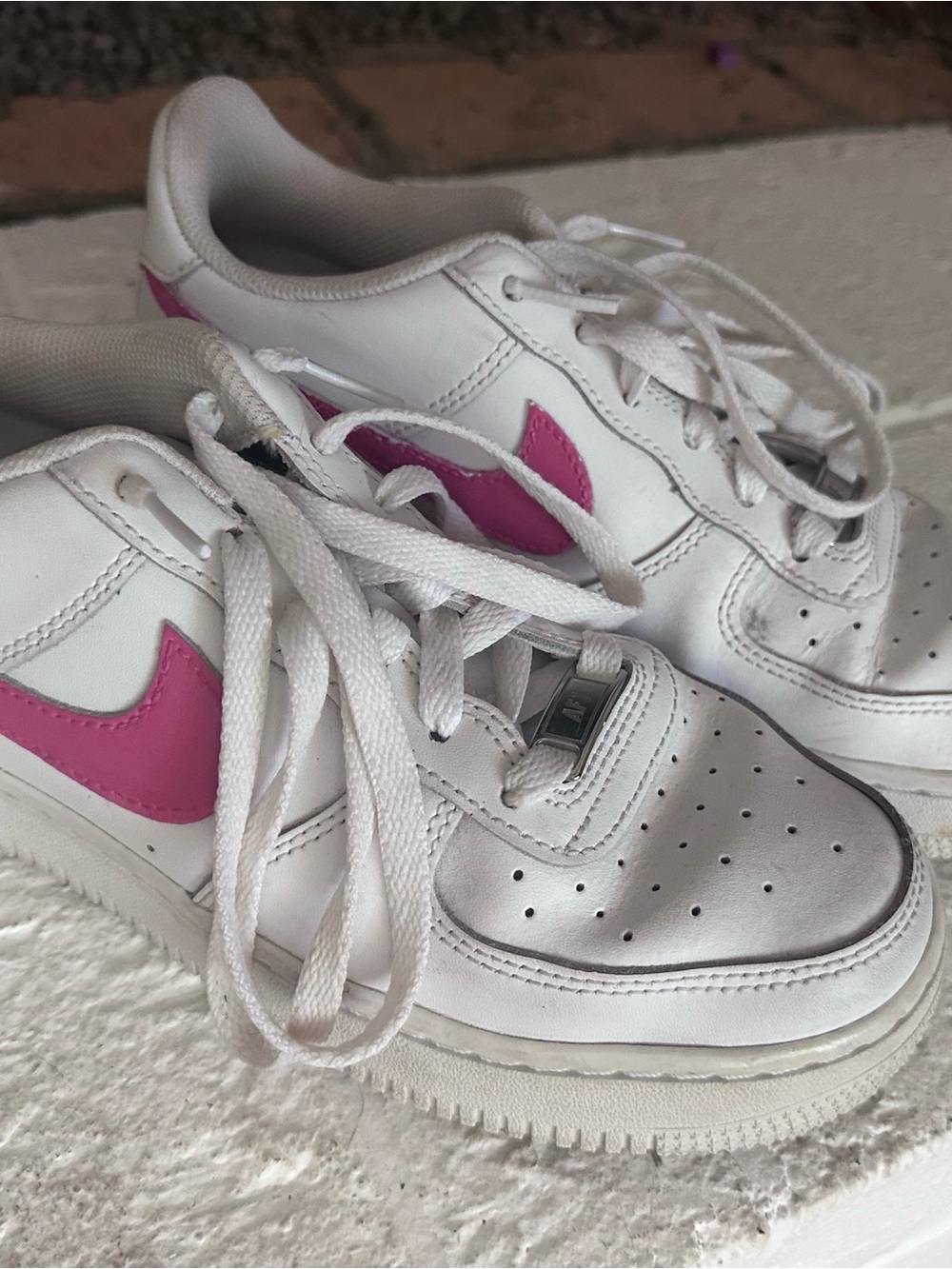 Nike Women's White Sneakers with Pink Swoosh